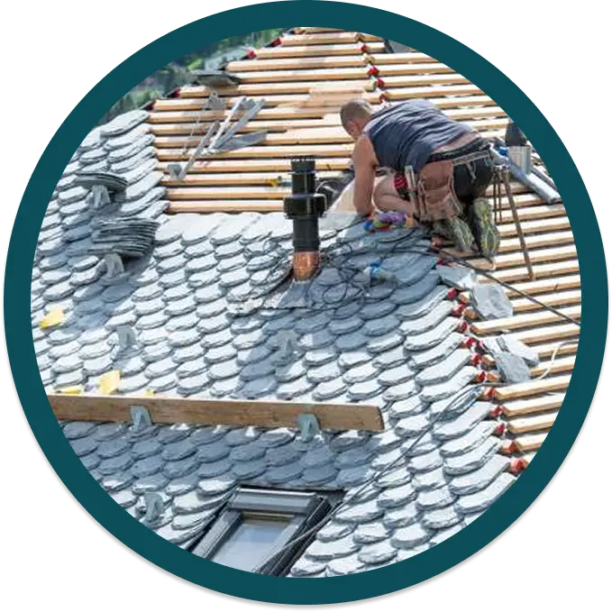 a roofer working on a thatched roof