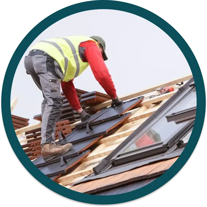 a roofer installing roof tiles on a residential property