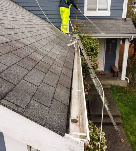 gutter on blue home after cleaning